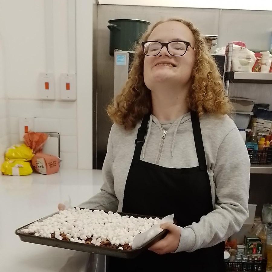 One Moreton student presenting a finished recipe.