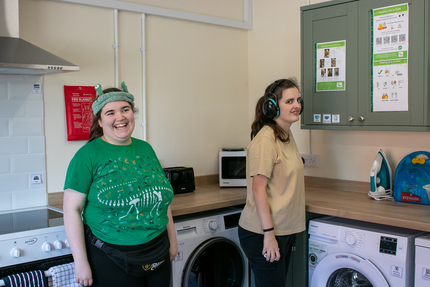 Two students in the Kitchen Section of an independent living suite at the EMA Gillingham Campus.