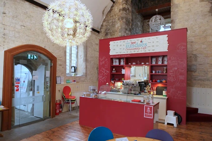 A not just sundaes community cafe space, with a serving counter, used for EMA drop-in sessions.