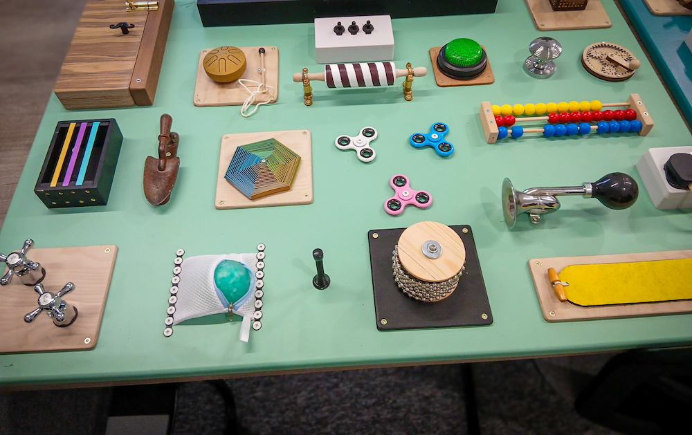 A fidget board with a diverse range of interactive sensory tools.